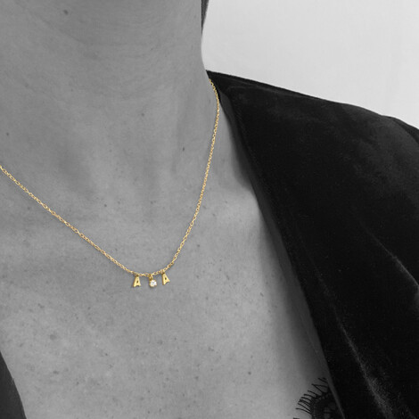 Clarity name necklace in 18kt solid gold and diamonds